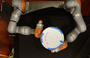 a Kuka robot handling a bucket.